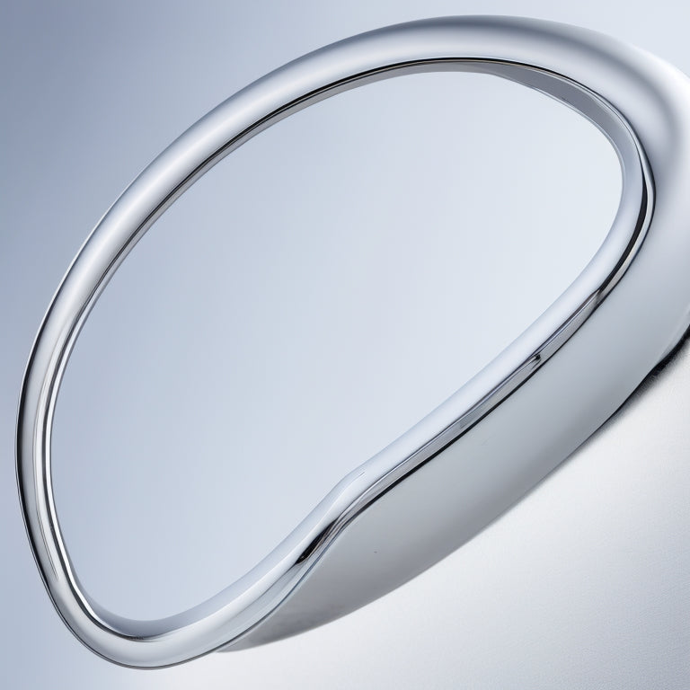 A close-up of a modern, sleek chrome shower faucet trim with an ADA-compliant handle, featuring a curved, ergonomic design and a subtle, satin finish, set against a clean, white background.